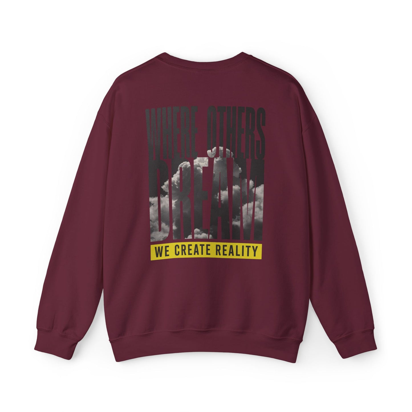Back of the maroon Where Others Dream Crewneck Sweatshirt with the city skyline graphic and yellow We Create Reality banner.