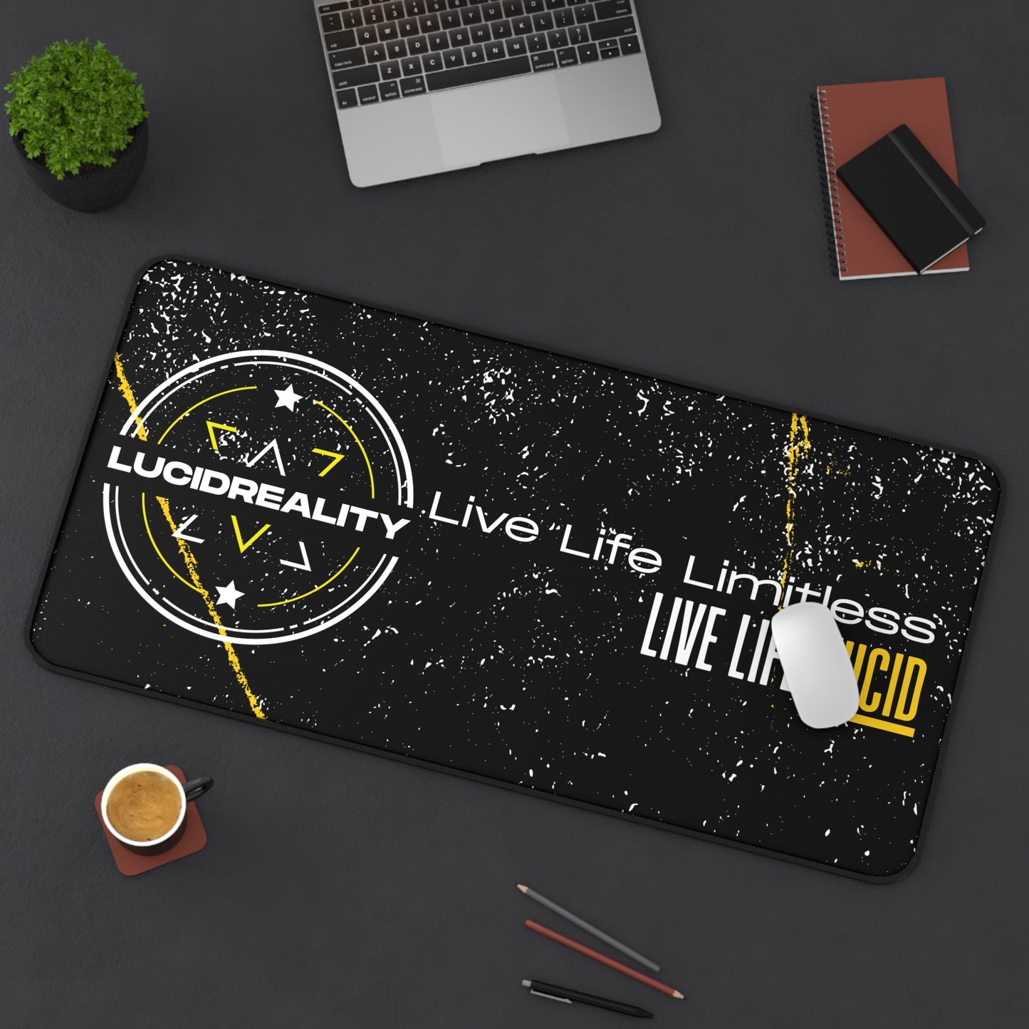 Live Life Limitless 16x32 desk mat styled on a desk with a laptop, notebook, and coffee
