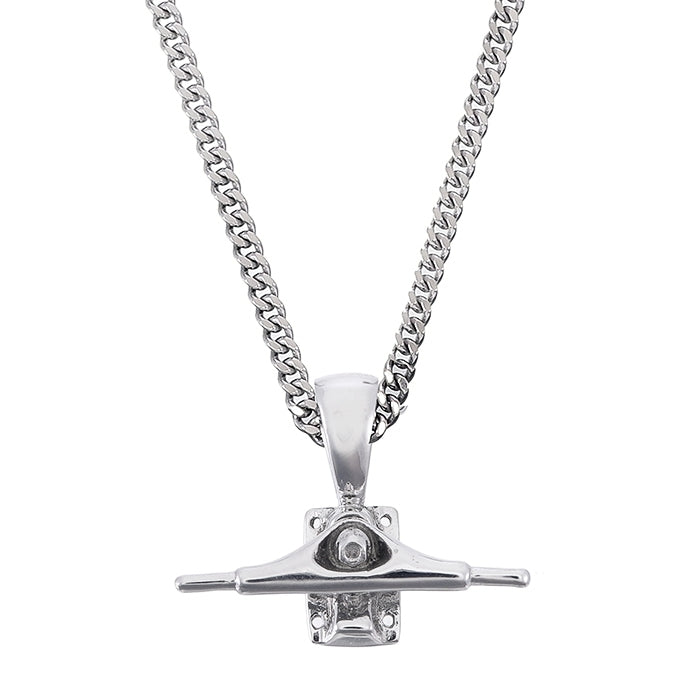 Sterling silver skateboard truck pendant on a Cuban chain, curated by Lucid Reality
