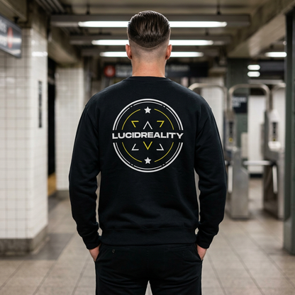 Man wearing the black Lucid Reality Logo Crewneck Sweatshirt in a subway station, showing the large circular shield logo on the back.