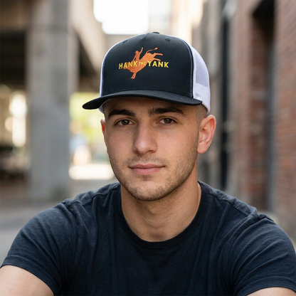 Man wearing the Lucid Reality x Hank The Yank Longhorn Trucker Cap in black and white, featuring the red longhorn bull rider design on the front.