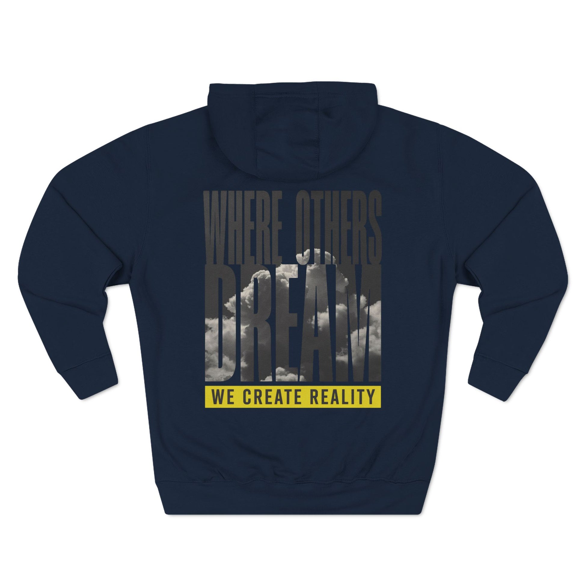 Back of the navy Where Others Dream Fleece Pullover Hoodie with the city skyline graphic and yellow We Create Reality banner.