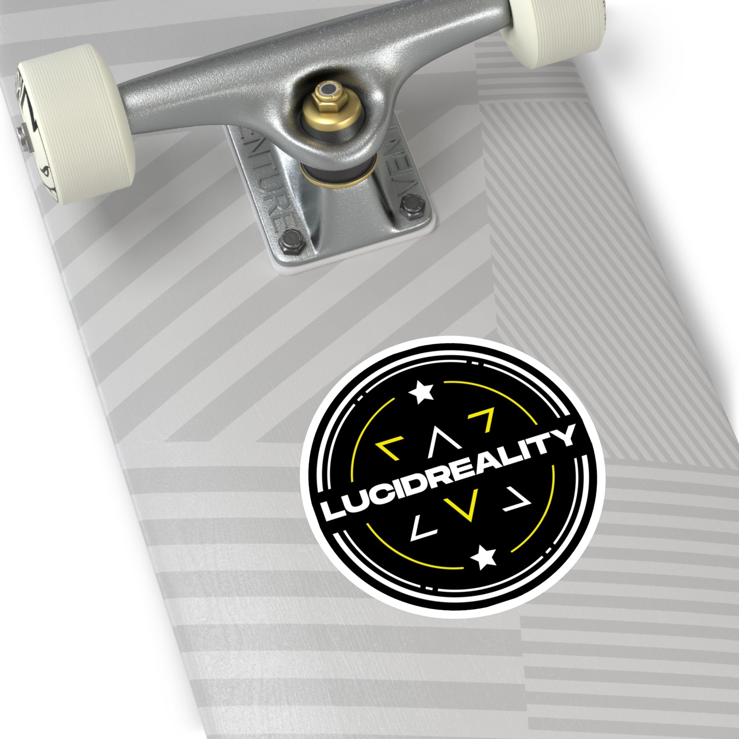 Round Lucid Reality logo sticker applied to the bottom of a skateboard deck, featuring the black circular shield design with white "LUCID REALITY" text.
