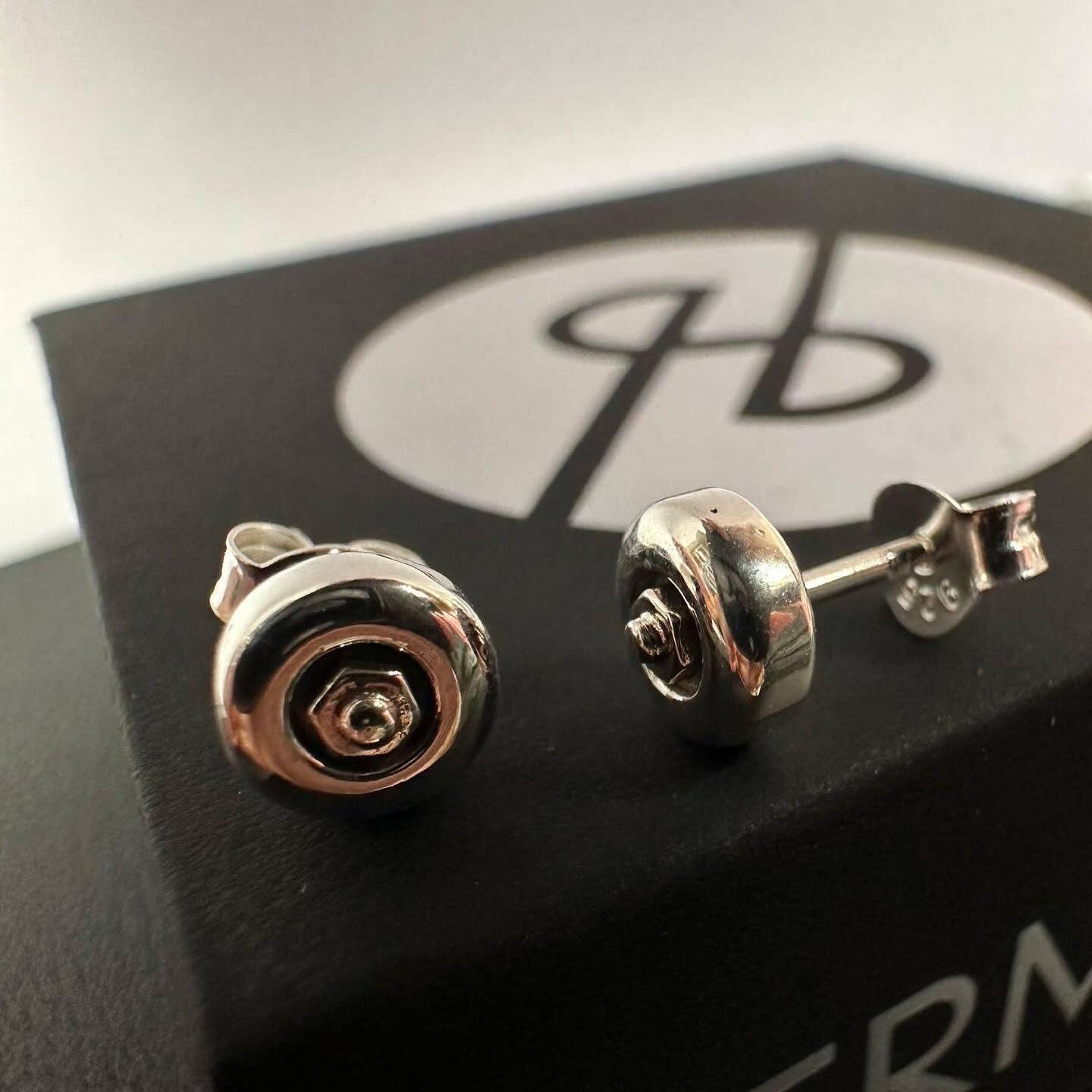 Sterling silver skateboard wheel stud earrings, curated by Lucid Reality