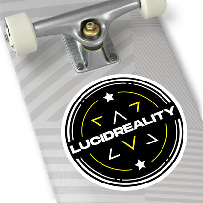Black circular Lucid Reality logo sticker displayed on a skateboard deck.