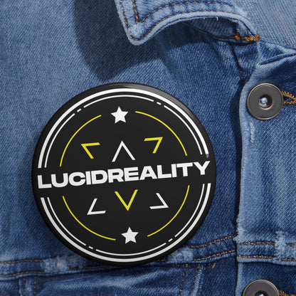 Lucid Reality logo pin-back button, angled view on denim
