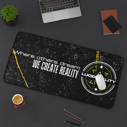 Where Others Dream 16x32 desk mat styled on a desk with a laptop, notebook, and coffee