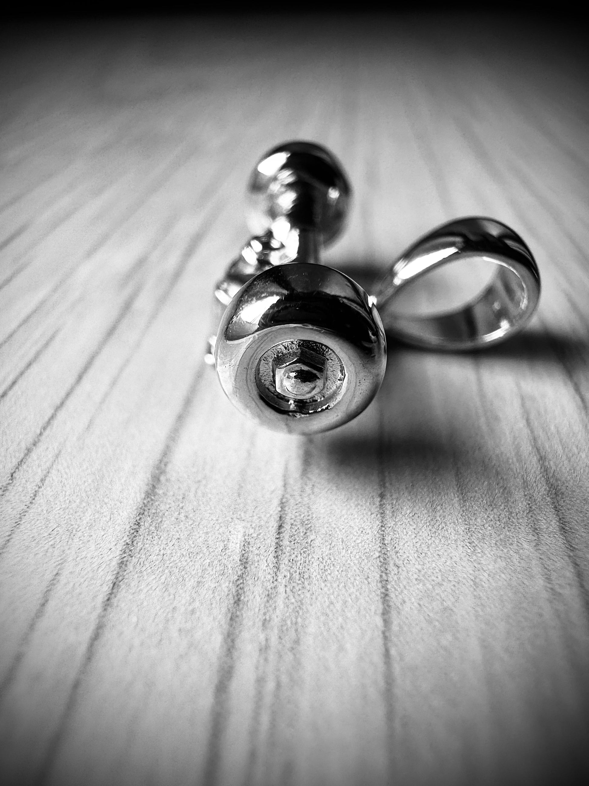 Sterling silver skateboard truck with wheels pendant on a Cuban chain, curated by Lucid Reality