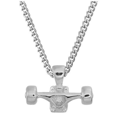 Sterling silver skateboard truck with wheels pendant on a Cuban chain, curated by Lucid Reality
