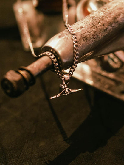 Sterling silver skateboard truck pendant on a Cuban chain, curated by Lucid Reality