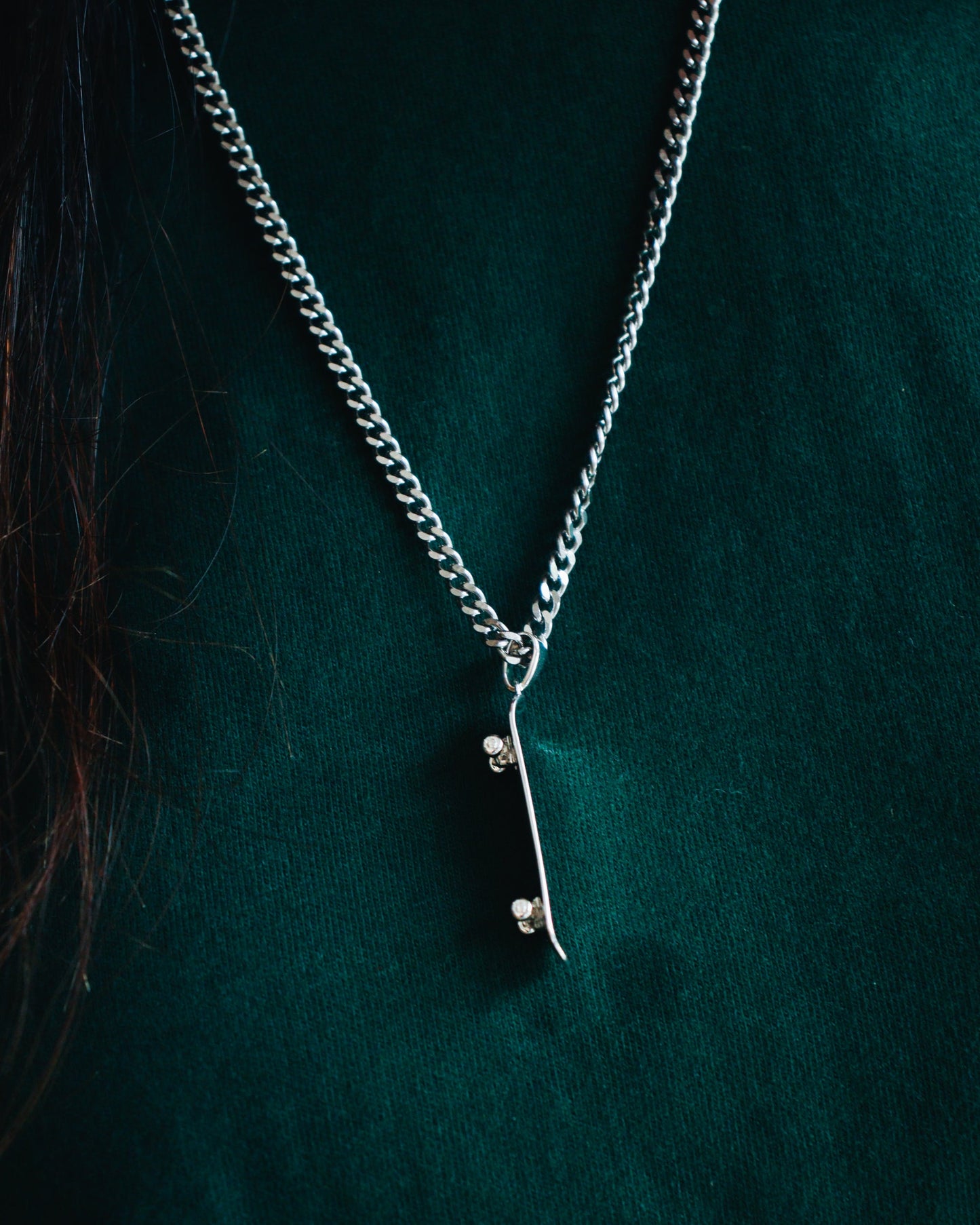 Sterling silver skateboard deck pendant with matching ring, curated by Lucid Reality