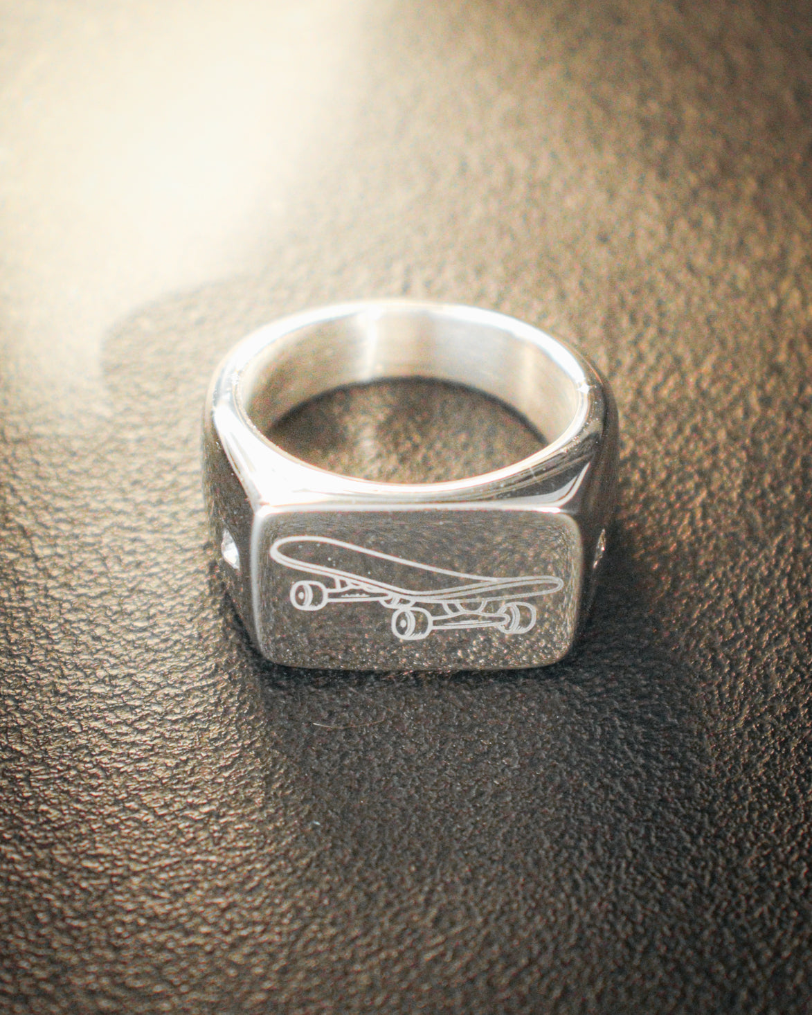 Sterling silver skateboard deck pendant with matching ring, curated by Lucid Reality