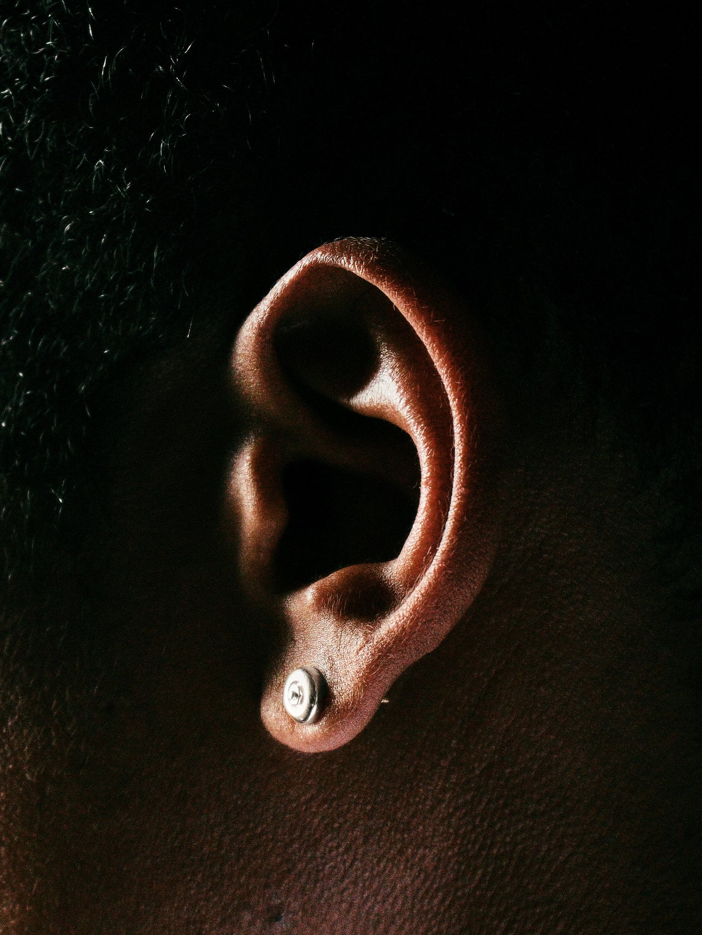 Sterling silver skateboard wheel stud earrings, curated by Lucid Reality