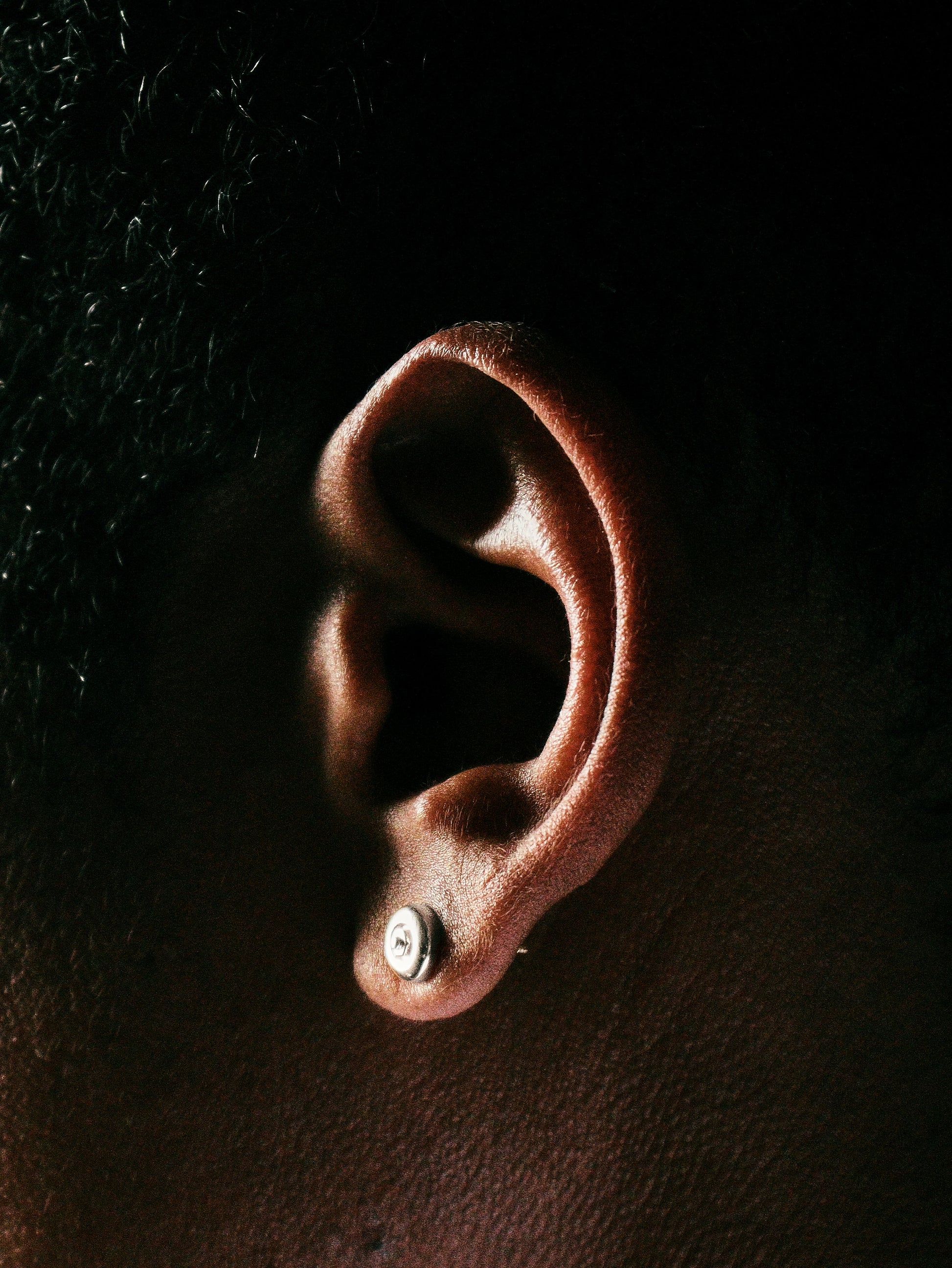 Sterling silver skateboard wheel stud earrings, curated by Lucid Reality