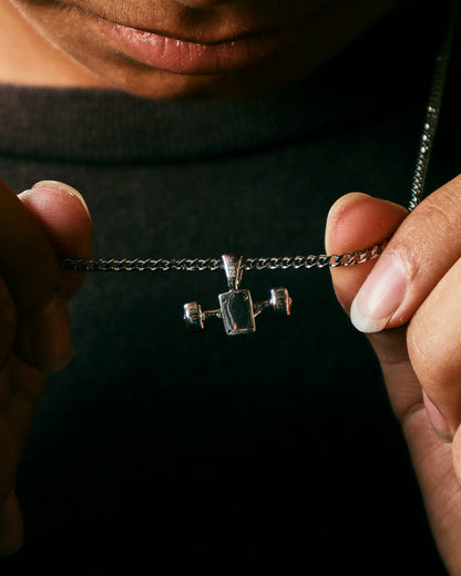 Sterling silver skateboard truck with wheels pendant on a Cuban chain, curated by Lucid Reality