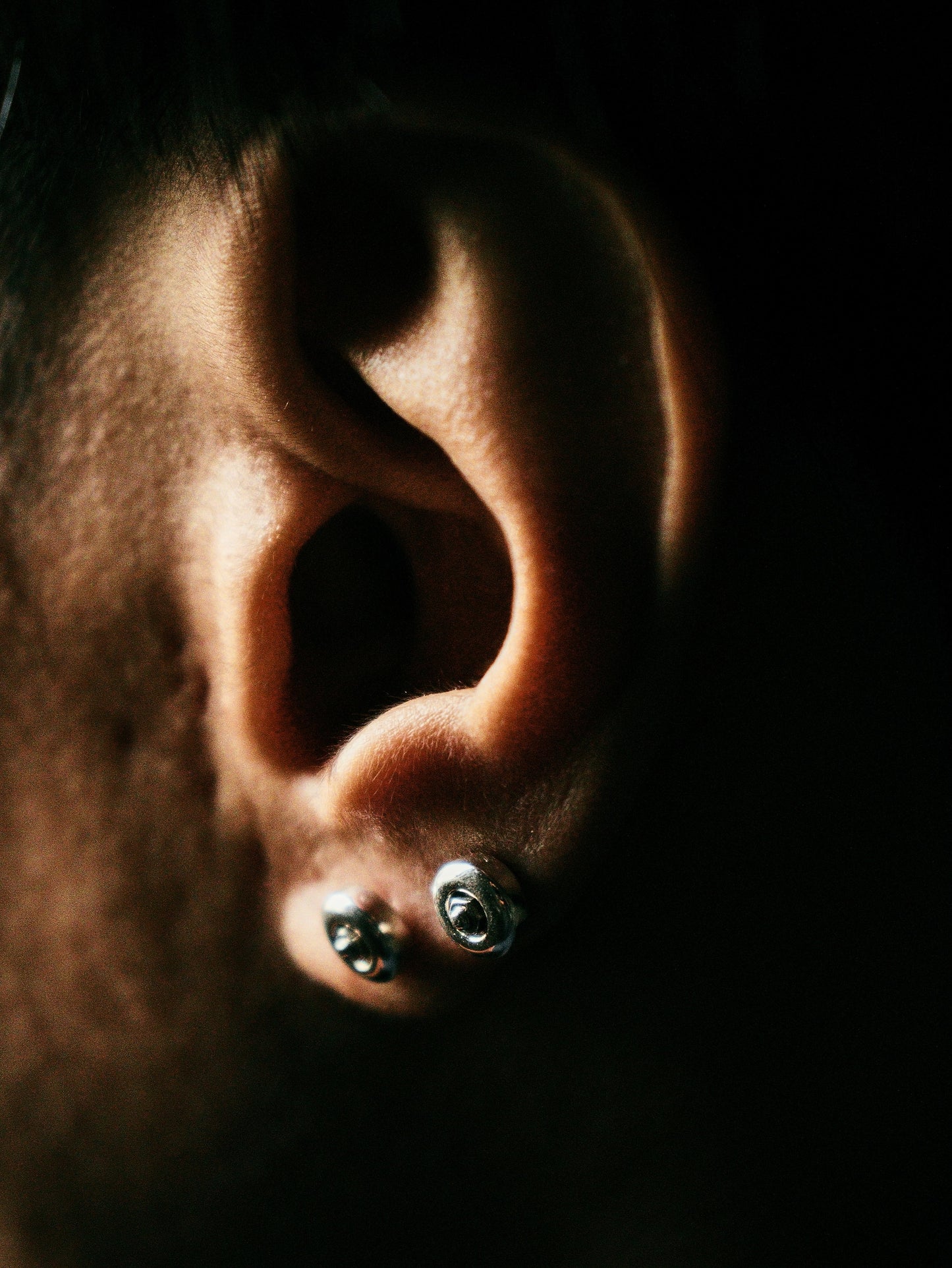 Sterling silver skateboard wheel stud earrings, curated by Lucid Reality