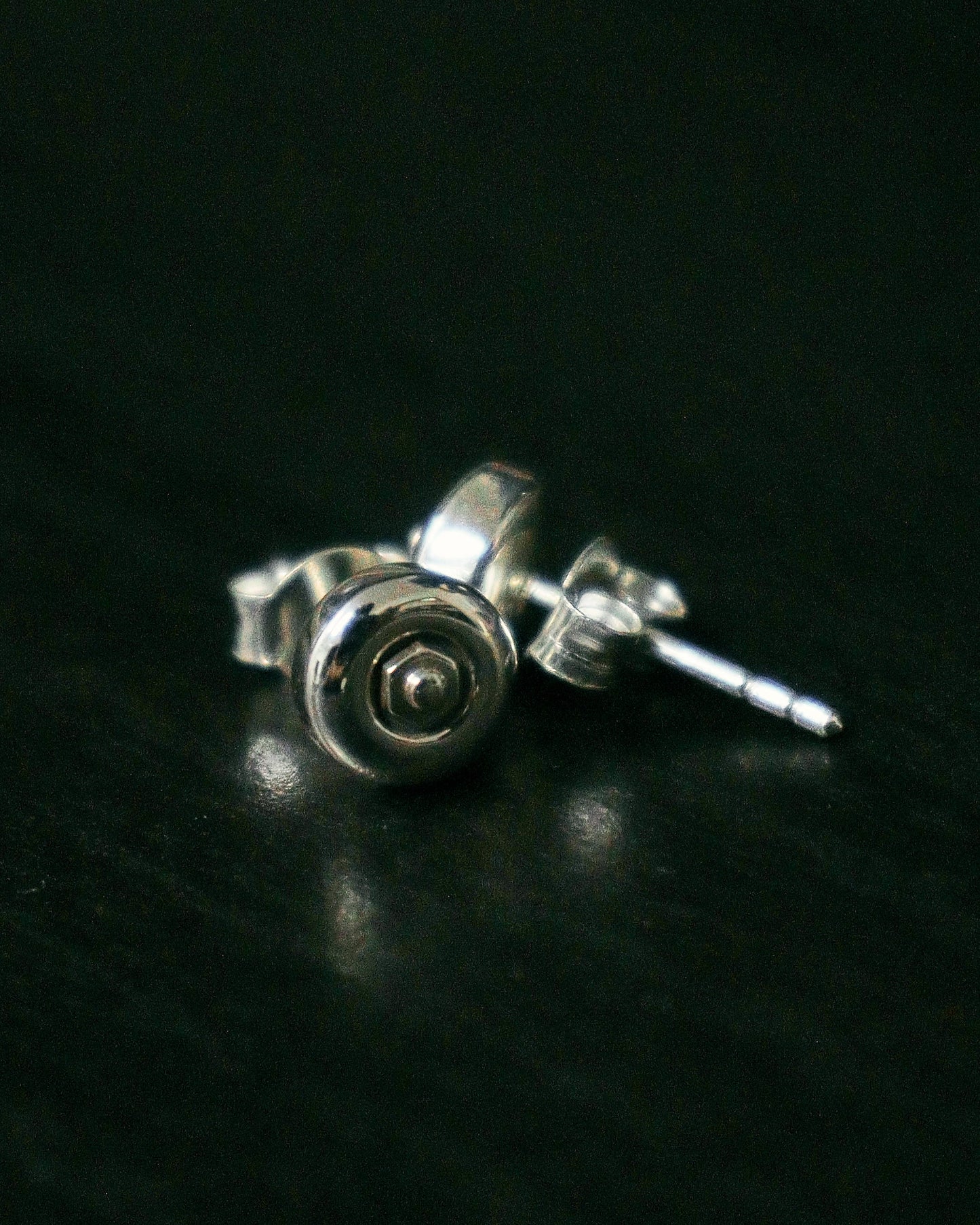 Sterling silver skateboard wheel stud earrings, curated by Lucid Reality