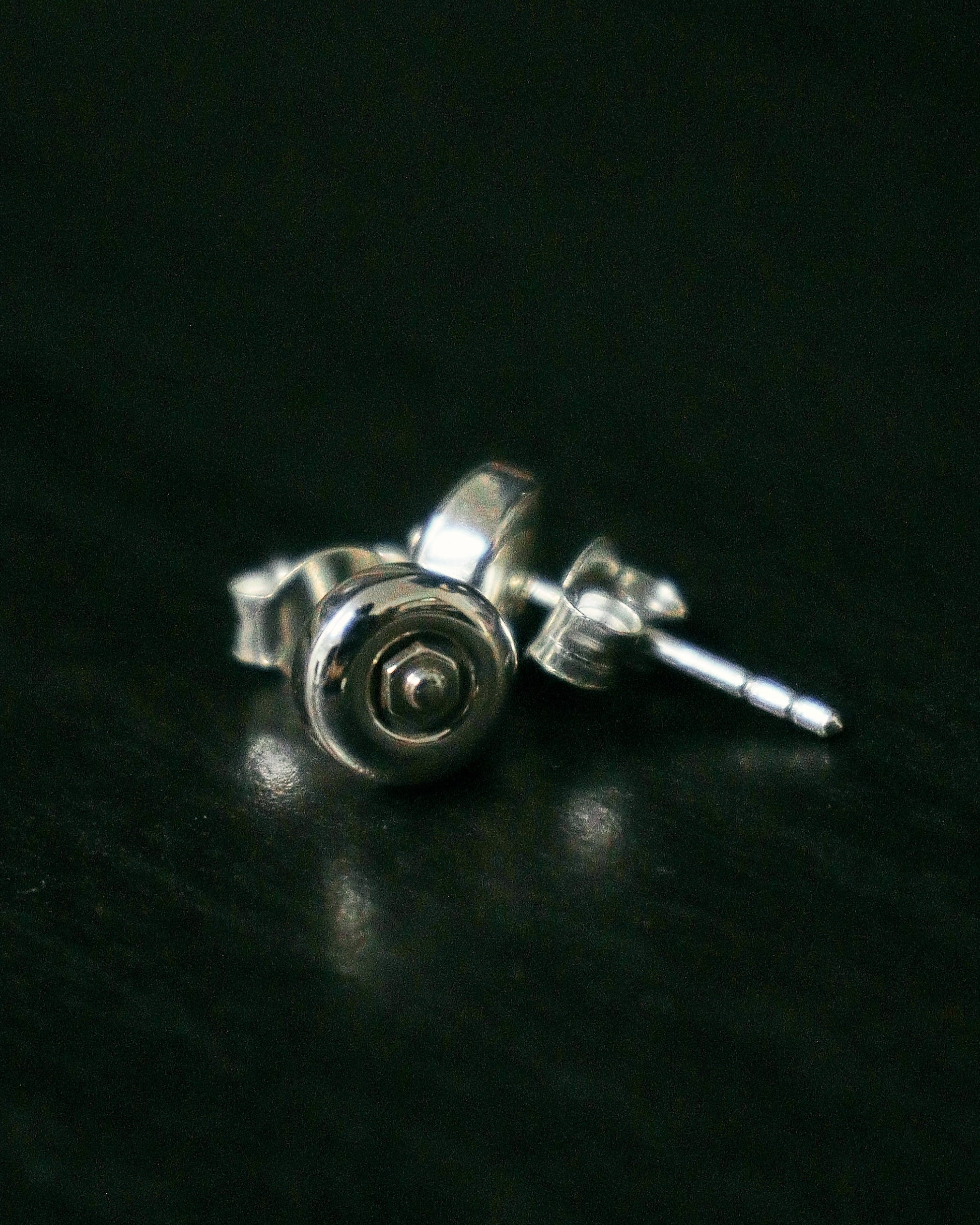 Sterling silver skateboard wheel stud earrings, curated by Lucid Reality